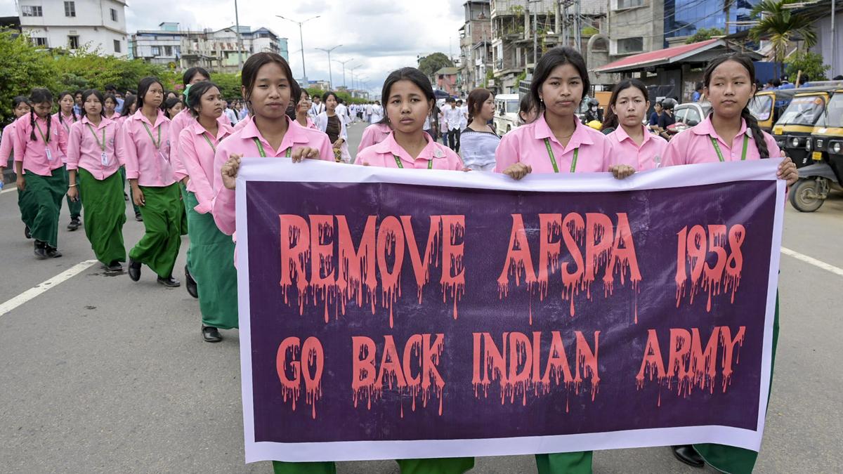 Protesters hold a banner opposing the Armed Forces (Special Powers) Act following its extension in parts of the northeastern states.