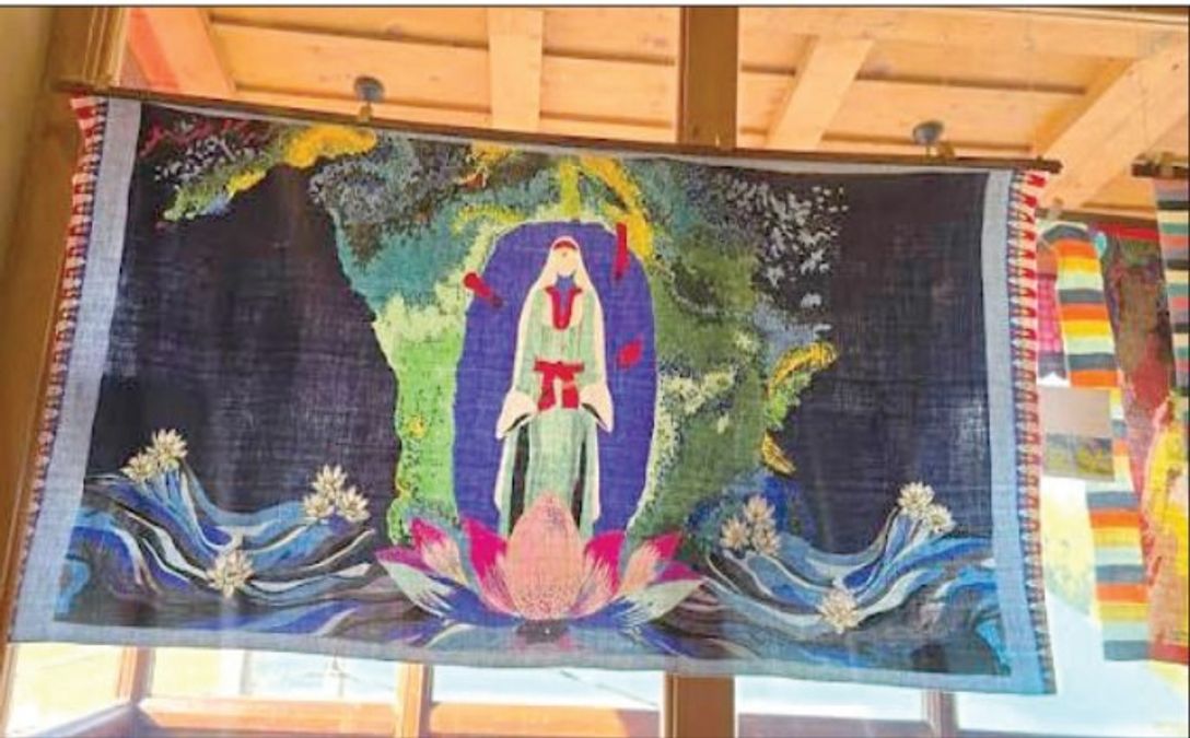 Artist Masood Hussain's artwork featuring the verses of 14th-century mystic poet Lal Ded painted on traditional Pashmina fabric.