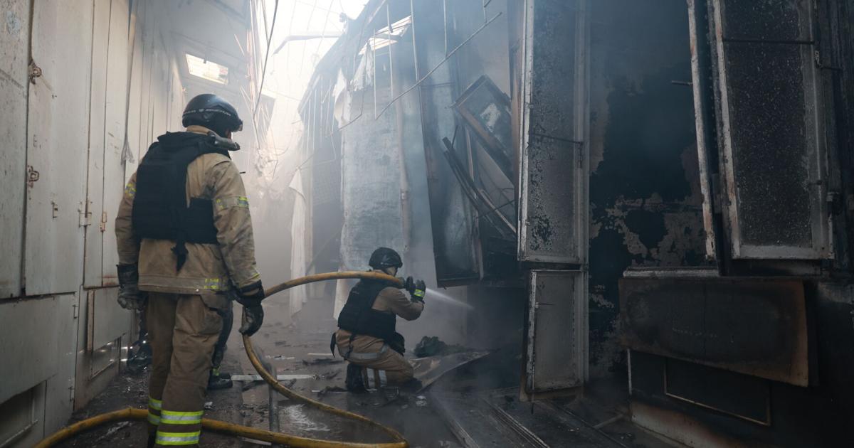 Emergency responders work at a site following Russian strikes in Ukraine that resulted in multiple casualties.