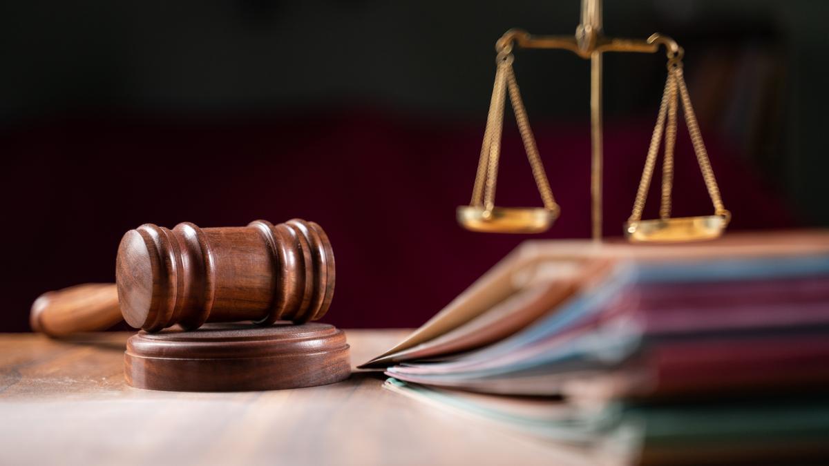 A gavel and legal scales representing the High Court proceedings regarding electoral roll deletions.