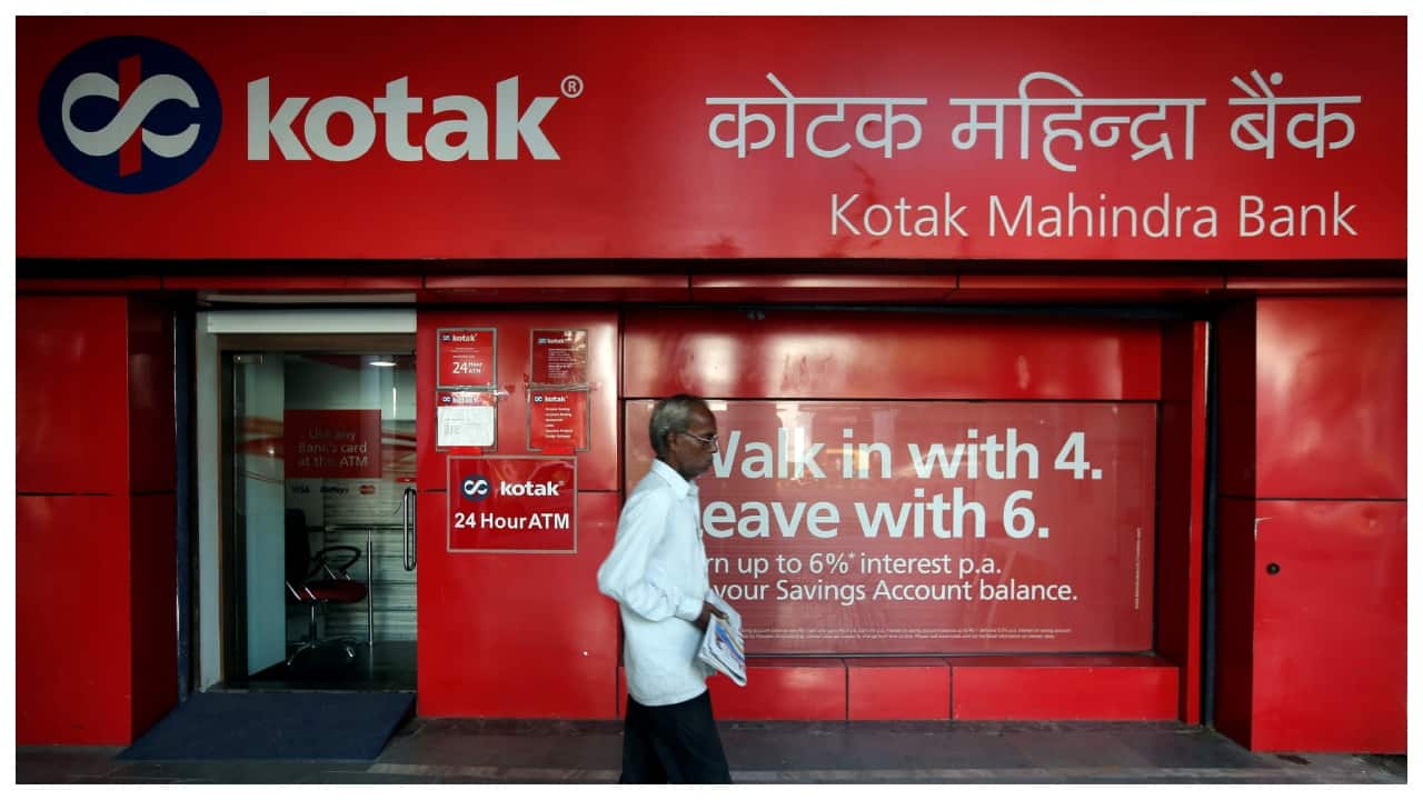 A person walks past a branch of Kotak Mahindra Bank, which has named Anup Kumar Saha as its next chief executive officer.