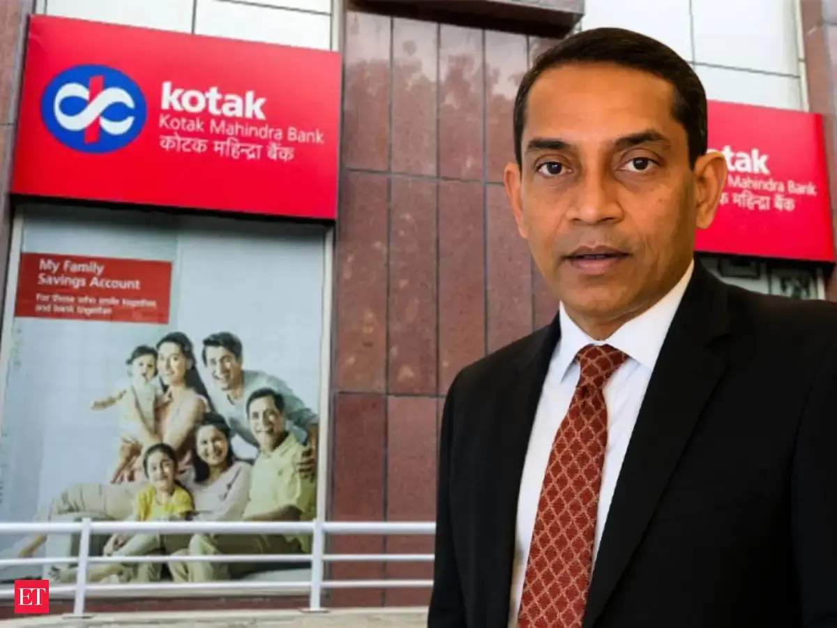 Anup Kumar Saha, who has been named chief executive officer of Kotak Mahindra Bank, standing in front of a bank branch.