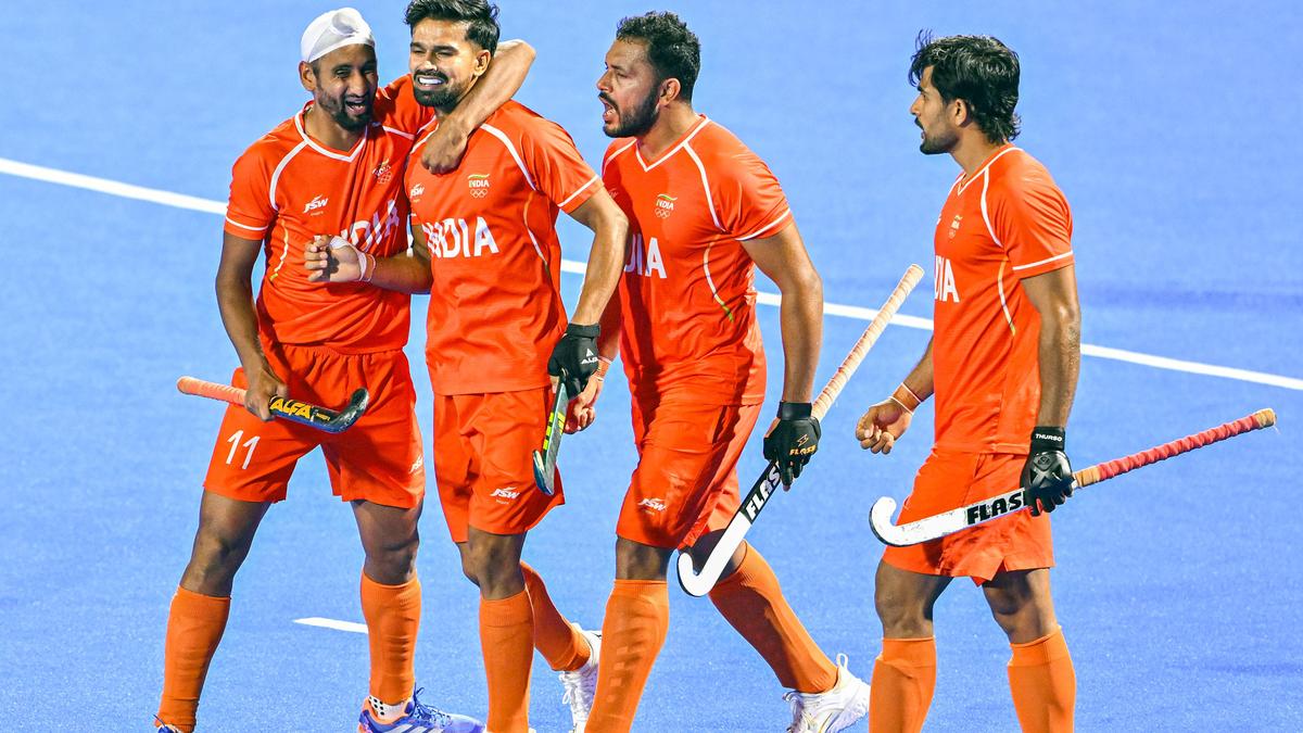 Indian men's hockey team players celebrate after defeating Pakistan in a tense match to reach the Asian Champions Trophy final.