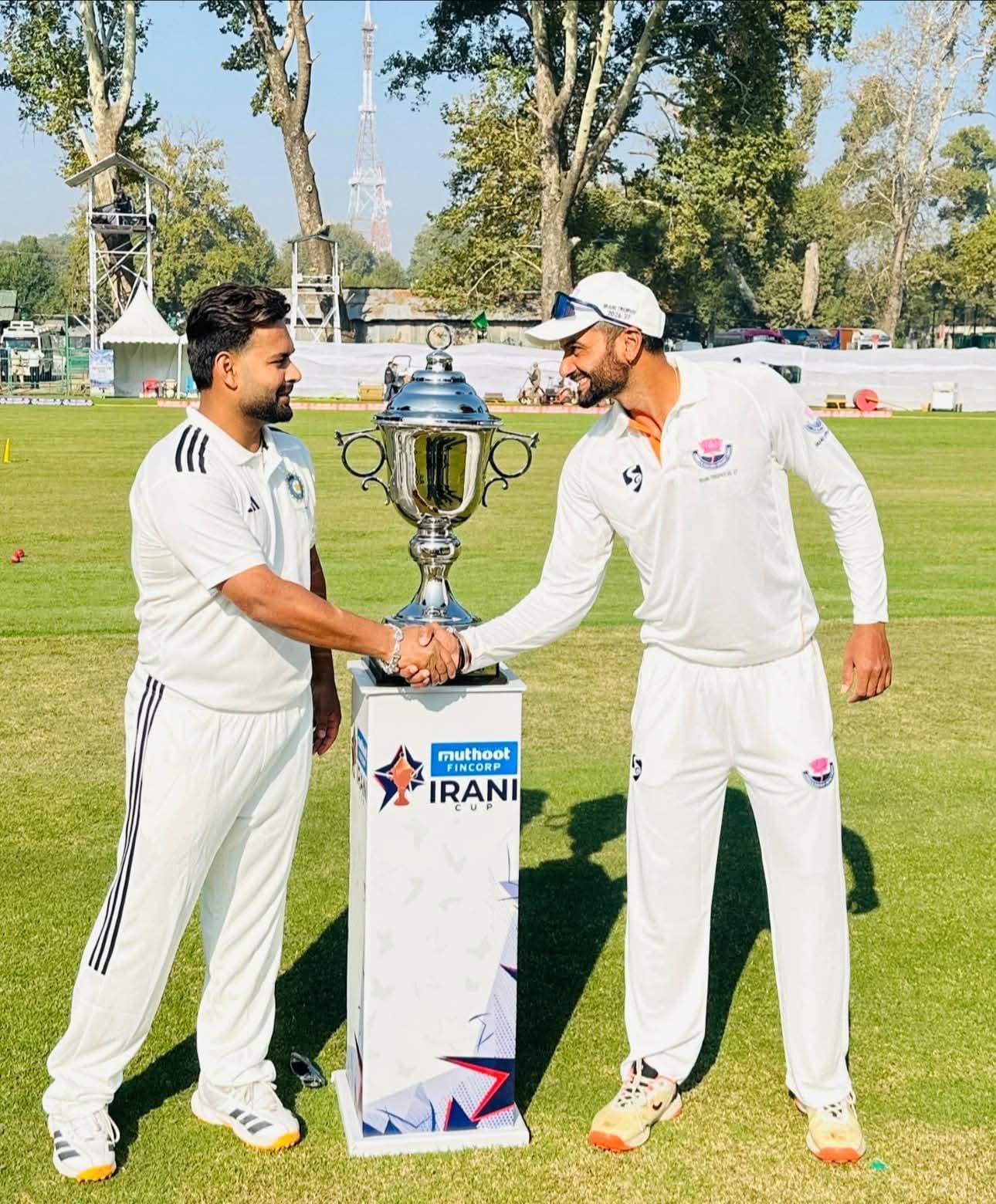 Captains pose with the Irani Cup trophy ahead of the domestic season opener.