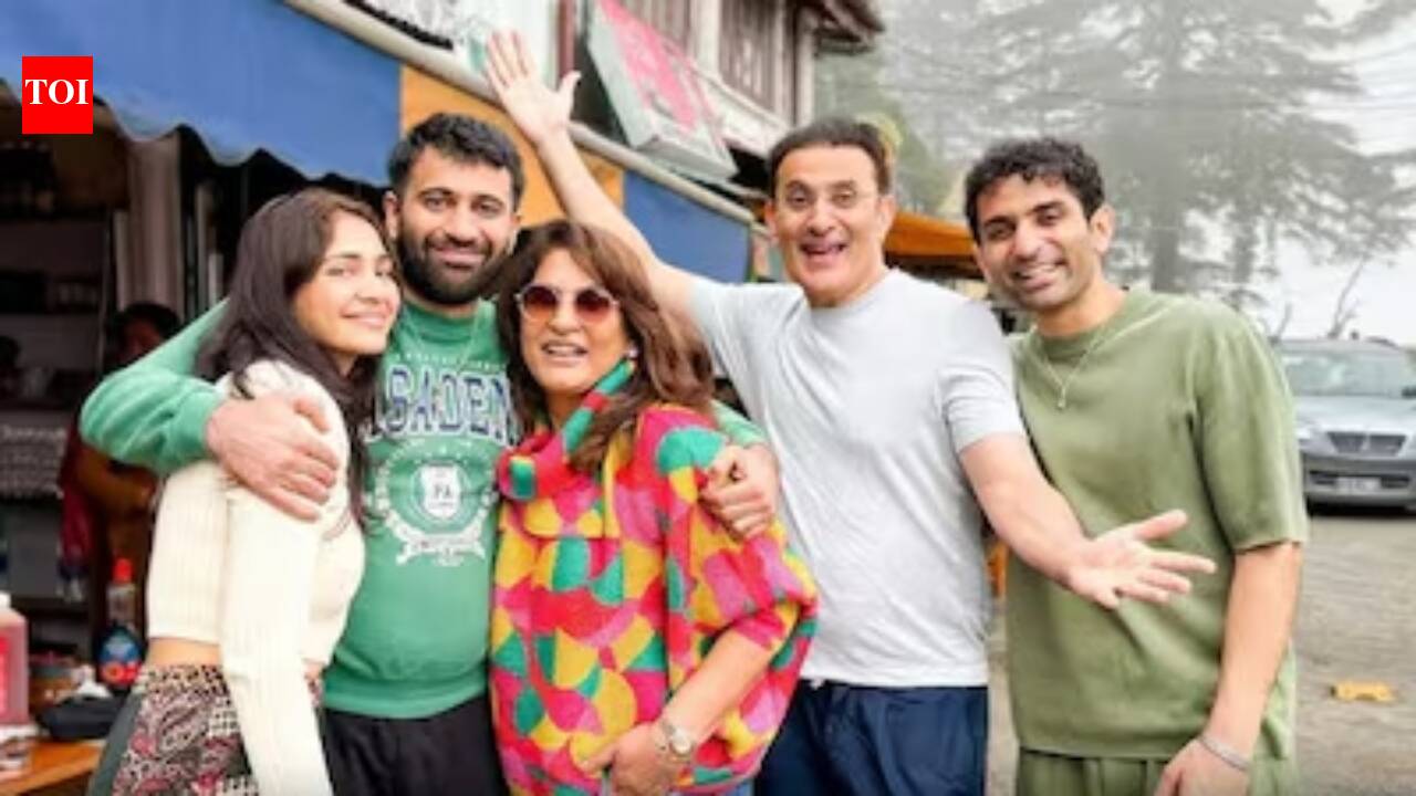 Archana Puran Singh and her family members pose together following the purchase of their new villa in Mumbai.